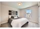 Bedroom with carpet, natural light, dark wood headboard, and grey bedding at 1896 Hogan Ct, Castle Rock, CO 80109