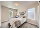 Bedroom with carpet, natural light, and tree-shaped headboard at 1896 Hogan Ct, Castle Rock, CO 80109