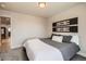 Bedroom with carpet, view to kitchen, and dark wood headboard at 1896 Hogan Ct, Castle Rock, CO 80109