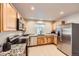 Functional kitchen featuring granite counters, stainless steel appliances, and light-colored cabinetry at 1896 Hogan Ct, Castle Rock, CO 80109