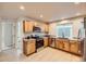 Well-lit kitchen featuring granite counters, stainless appliances, and light-colored cabinetry at 1896 Hogan Ct, Castle Rock, CO 80109