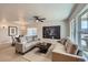 Bright living room with hardwood floors, neutral tones, and lots of natural light at 1896 Hogan Ct, Castle Rock, CO 80109