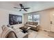 Comfortable living area with modern ceiling fan, lots of natural light, and neutral decor at 1896 Hogan Ct, Castle Rock, CO 80109