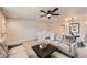 Comfortable living room seamlessly integrates into a dining area and features neutral decor at 1896 Hogan Ct, Castle Rock, CO 80109