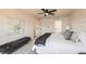 Neutral bedroom with carpet, ceiling fan, and ensuite bathroom offers comfort and convenience at 1896 Hogan Ct, Castle Rock, CO 80109