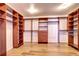 Spacious walk-in closet features custom shelving, drawers, and ample storage solutions at 6074 S Oswego St, Greenwood Village, CO 80111