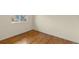 Bedroom with hardwood floors and natural light from two windows at 4211 E 69Th Ave, Commerce City, CO 80022