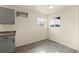 Bright kitchen area features neutral-toned cabinets, ample natural light, and modern flooring at 4211 E 69Th Ave, Commerce City, CO 80022