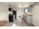 Renovated kitchen features stainless appliances, updated cabinetry, and durable flooring at 4211 E 69Th Ave, Commerce City, CO 80022