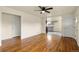 Spacious living room with hardwood floors leads to the kitchen, offering an open layout at 4211 E 69Th Ave, Commerce City, CO 80022
