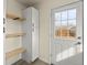 Mud room with storage cabinets and shelves and a view to the outdoors at 4211 E 69Th Ave, Commerce City, CO 80022