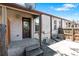 Back of the home featuring an unfinished porch and entrance to the basement at 1211 E 26Th Ave, Denver, CO 80205