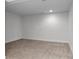 Finished basement area with plush carpeting, recessed lighting, and neutral paint at 1211 E 26Th Ave, Denver, CO 80205