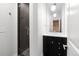Updated bathroom with glass shower and modern vanity, pendant lighting, and sleek fixtures at 1211 E 26Th Ave, Denver, CO 80205