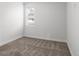 Bedroom features neutral carpet, white walls and a window with blinds for natural light and privacy at 1211 E 26Th Ave, Denver, CO 80205