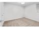 A carpeted bedroom provides a simple yet comfortable space with a window at 1211 E 26Th Ave, Denver, CO 80205