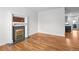 Spacious living room with hardwood floors, highlighting a decorative fireplace and open layout at 1211 E 26Th Ave, Denver, CO 80205