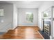 Bright living room featuring hardwood floors and a decorative fireplace at 1211 E 26Th Ave, Denver, CO 80205