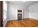 Bright living room with hardwood floors and a decorative fireplace, showcasing a cozy and inviting space at 1211 E 26Th Ave, Denver, CO 80205