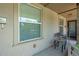 Cozy front porch with seating area, perfect for relaxing and enjoying the neighborhood views at 1211 E 26Th Ave, Denver, CO 80205