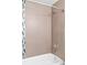 Modern shower area featuring neutral tile, and updated shower head at 1211 E 26Th Ave, Denver, CO 80205