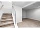 Carpeted staircase with modern railings leading to additional living space in the home at 1211 E 26Th Ave, Denver, CO 80205