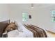 Bright bedroom features hardwood floors and a ceiling fan for added comfort at 1557 North St, Boulder, CO 80304