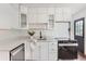 Modern kitchen with white cabinets, stainless steel appliances, and subway tile backsplash at 1557 North St, Boulder, CO 80304