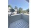 Private balcony area with wood-grained deck offers views of the community and surrounding neighborhood at 56 S Nome St, Aurora, CO 80012