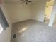 Bright bedroom featuring neutral paint, plush carpet, ceiling fan and an ensuite bathroom at 56 S Nome St, Aurora, CO 80012