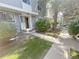 Inviting front exterior showcasing a well-manicured lawn, landscaped bushes, and pathway to the home's entrance at 56 S Nome St, Aurora, CO 80012