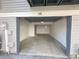 View into a clean, empty garage featuring painted walls and a concrete floor in neutral tones at 56 S Nome St, Aurora, CO 80012