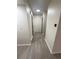 Bright and clean hallway features modern floors and convenient access to all rooms and levels at 56 S Nome St, Aurora, CO 80012