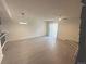 Bright, airy living room features modern floors and sliding door access to private patio at 56 S Nome St, Aurora, CO 80012