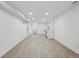 Large basement space with vinyl floors, modern wet bar, and lots of open space at 1209 Harrison St, Denver, CO 80206