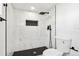 Shower with marble tile, rainfall shower head, and a modern, built-in shower niche at 1209 Harrison St, Denver, CO 80206