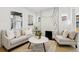 Bright living room features a modern marble fireplace, neutral decor, and ample natural light at 1209 Harrison St, Denver, CO 80206