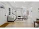 Bright living room with hardwood floors and a modern marble fireplace, and ample natural light at 1209 Harrison St, Denver, CO 80206