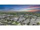 An aerial view showing a Primary-planned community complete with tree-lined streets and green spaces at 3453 Pacific Peak Dr, Broomfield, CO 80023