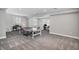 Spacious basement area with carpeting, featuring a ping pong table, piano, and an office space at 3453 Pacific Peak Dr, Broomfield, CO 80023