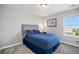 Calm bedroom with a padded headboard, dark comforter, and soft carpet that offers a peaceful and inviting space at 3453 Pacific Peak Dr, Broomfield, CO 80023