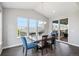 Elegant dining room with hardwood floors, large windows, and stylish furniture, perfect for entertaining at 3453 Pacific Peak Dr, Broomfield, CO 80023
