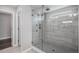 Elegant glass-enclosed shower boasts modern fixtures and stylish tile-work for a luxurious experience at 3453 Pacific Peak Dr, Broomfield, CO 80023