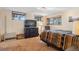 Bedroom featuring three windows, a television, wood dresser, and patterned carpet at 7282 Silverhorn Dr, Evergreen, CO 80439