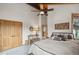 Bedroom with vaulted ceiling, wood beams, and a comfortable bed with decorative pillows at 7282 Silverhorn Dr, Evergreen, CO 80439