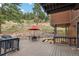 Multi-level decks with seating and grill, perfect for outdoor entertaining at 7282 Silverhorn Dr, Evergreen, CO 80439