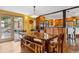 Charming dining area featuring a rustic table, wooden benches, and outdoor access at 7282 Silverhorn Dr, Evergreen, CO 80439