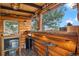 Charming cabin interior featuring wood walls, counter seating, and a modern fireplace at 7282 Silverhorn Dr, Evergreen, CO 80439