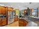 Stylish kitchen featuring stainless steel appliances, wood cabinets, and granite countertops at 7282 Silverhorn Dr, Evergreen, CO 80439