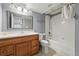 Bathroom featuring a single vanity, toilet, and shower/tub combination with gray walls at 4014 S Kirk Way, Aurora, CO 80013